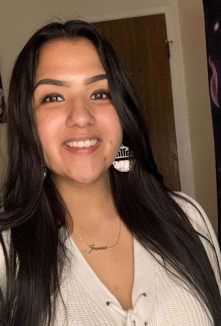 A headshot of a smiling person