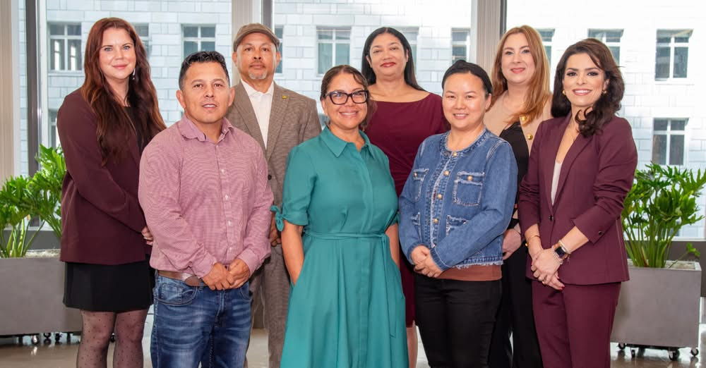 A group of people pose for the camera